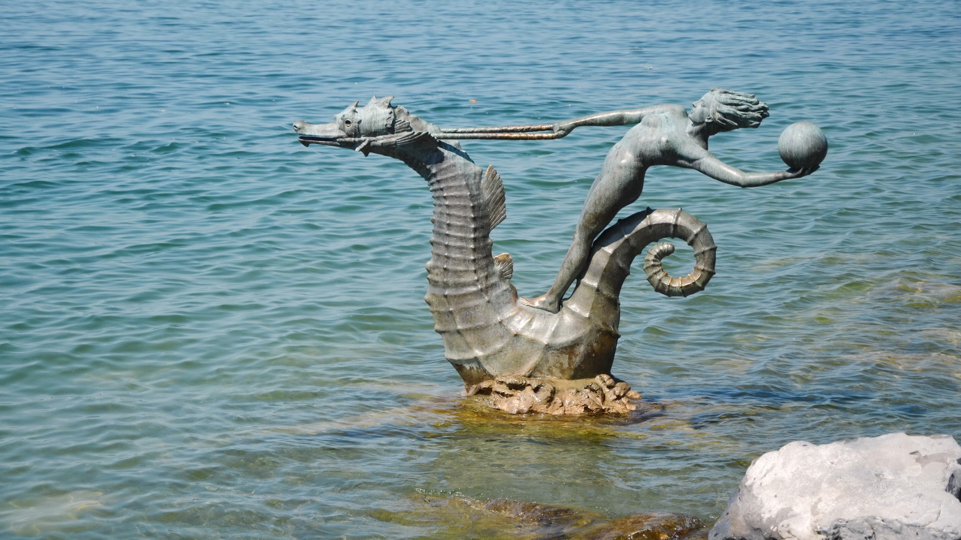 There are multiple sculptures along the shore in Vevey